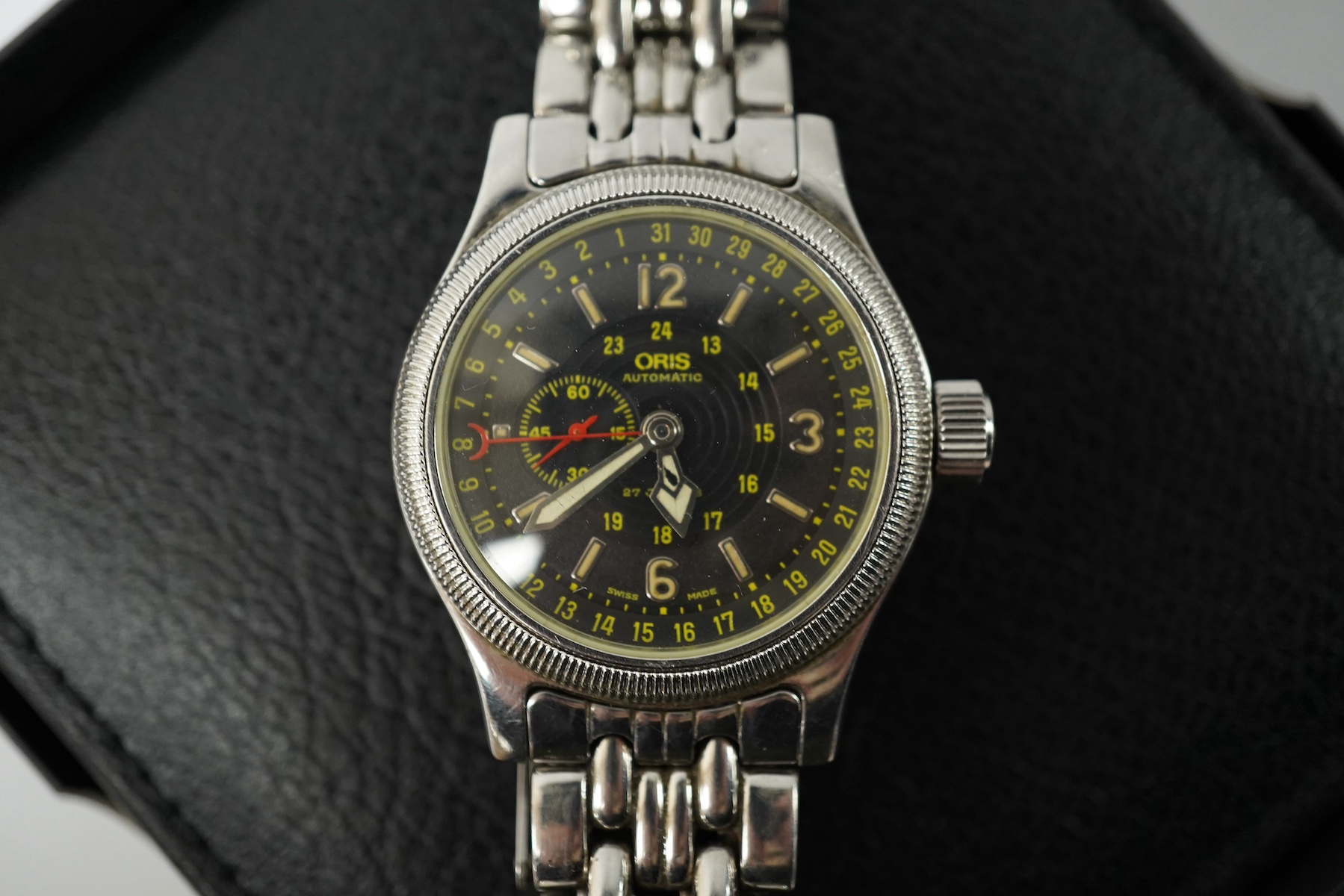 A gentleman's recent stainless steel Oris 640 Automatic wrist watch, with black dial, subsidiary seconds and Arabic and baton numerals, case diameter 36mm, on a stainless steel Oris bracelet, with receipt, box and papers